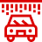 Ikona przedstawiająca samochód pod myjnią bezdotykową, z automatycznymi szczotkami i strumieniami wody, symbolizująca usługi myjni dla pojazdów.