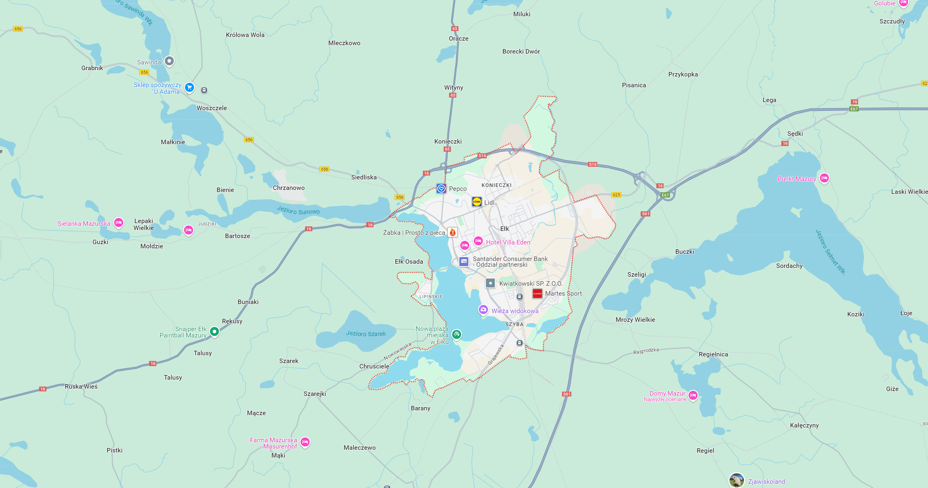 Mapa obszaru wokół Ełku, pokazująca lokalne drogi, jeziora i punkty usługowe, w tym sklepy i restauracje, w malowniczym regionie Mazur. Idealna dla osób planujących wizytę lub eksplorację tej okolicy.
